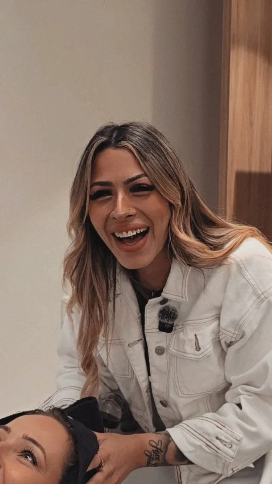 Laughing stylist with a client, the care that makes Vanity special